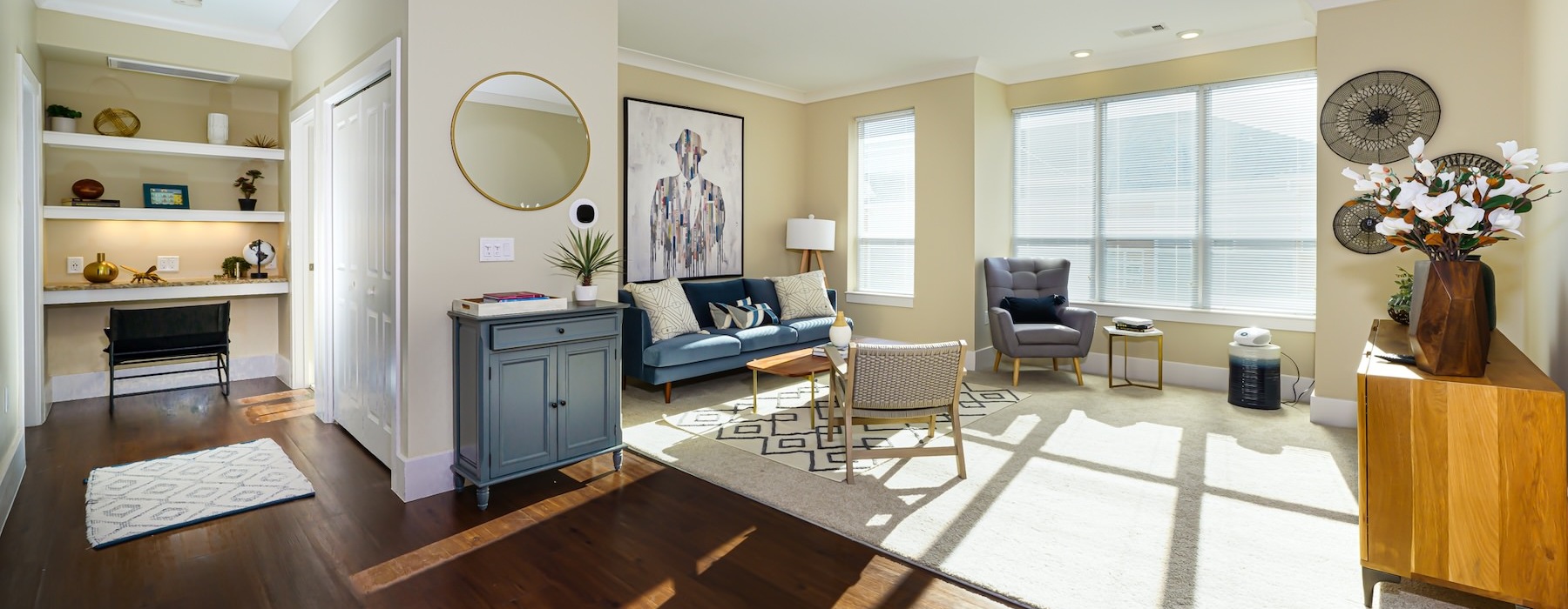 a living room with a couch and chairs