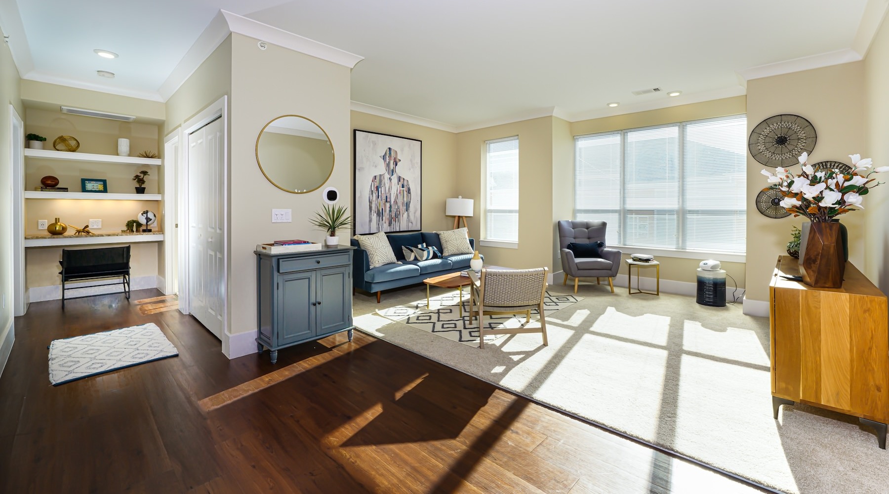 a living room with a couch and chairs