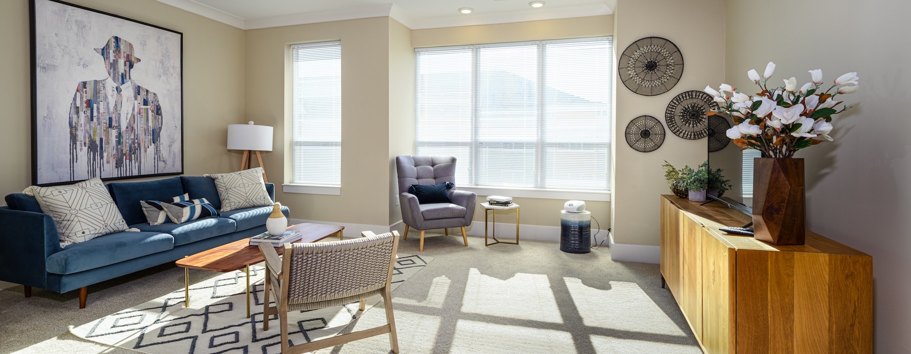 a living room with a couch and chairs