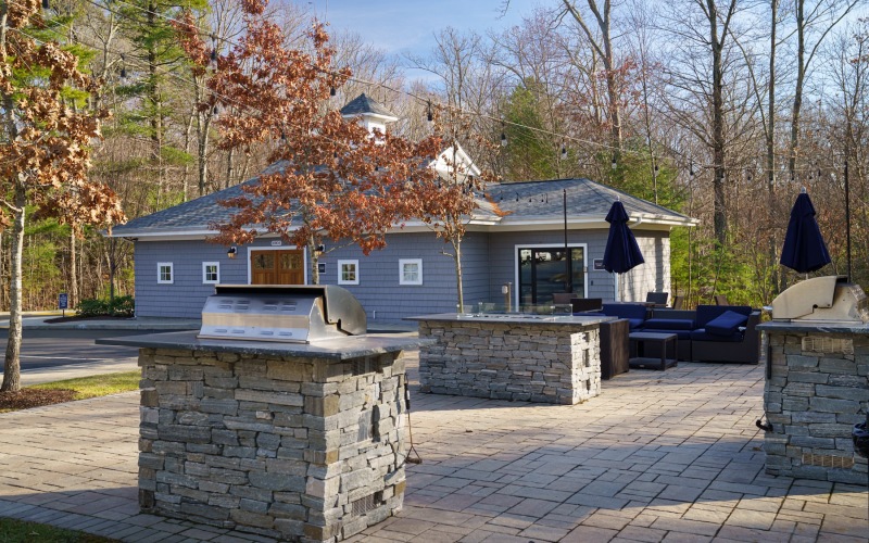 a grill area with chairs