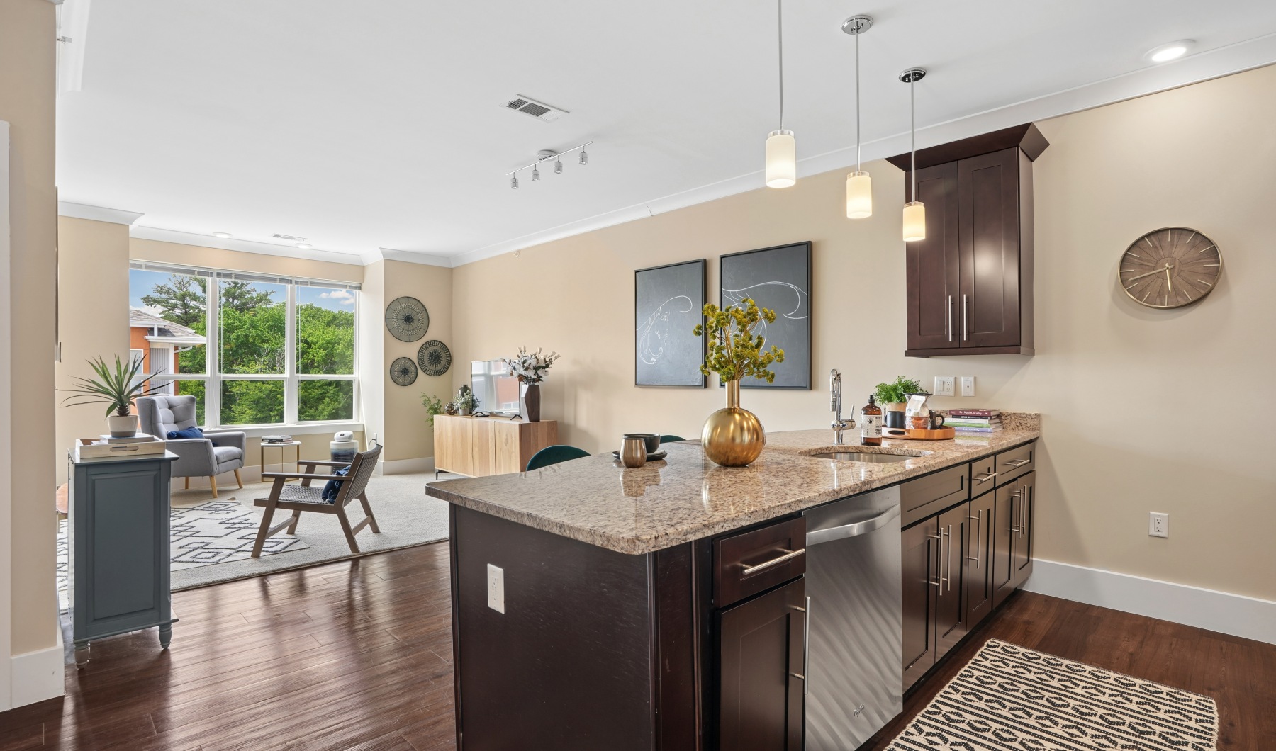 Modern apartment kitchen with granite countertops and stainless steel appliances at Matrix Hudson in Hudson MA
